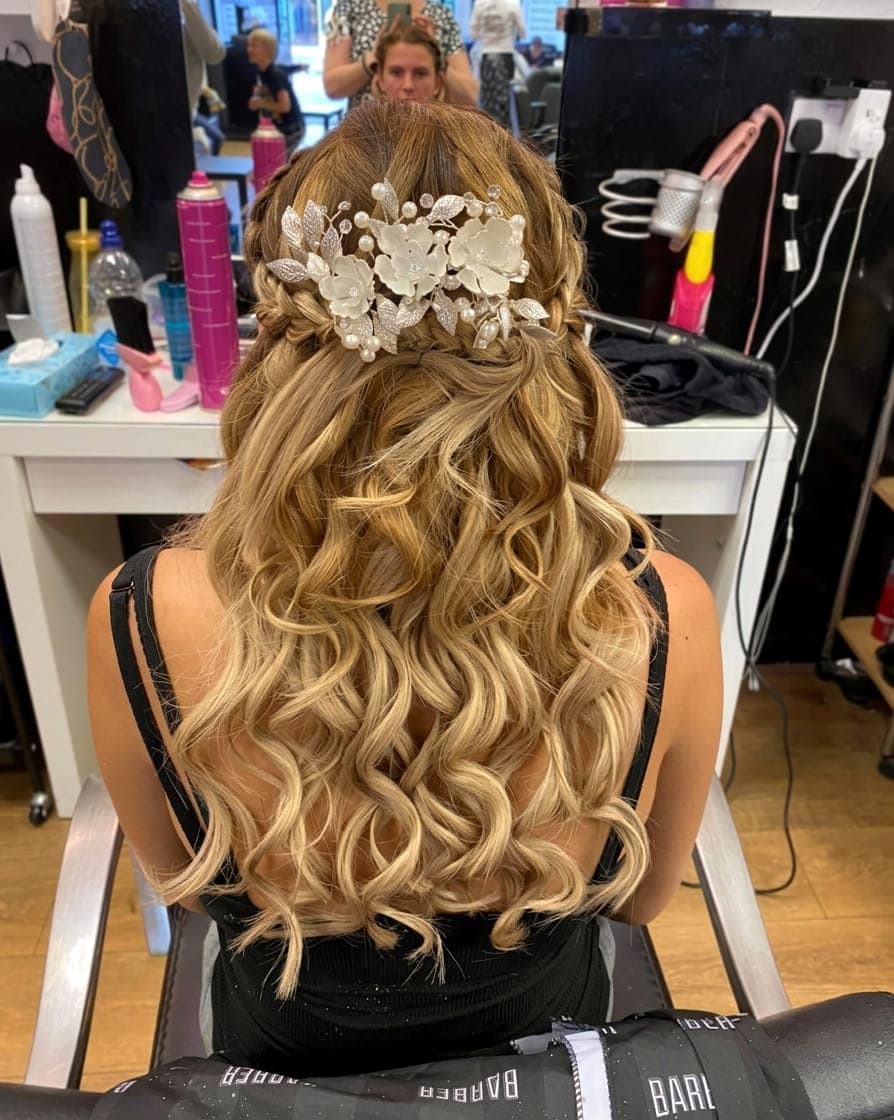 Occasion hair: soft curls dressed half-up and finished with a pearl and flower hair comb